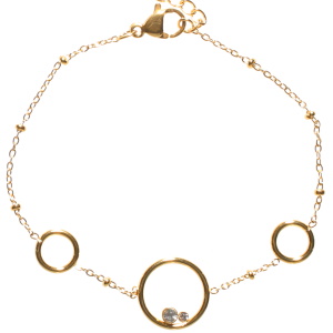 Bracelet composé d'une chaîne avec trois cercles en acier doré et de deux cristaux sertis clos. Fermoir mousqueton avec 3 cm de rallonge.