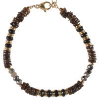 Bracelet composé de perles cylindriques en acier doré et de perles de couleur noire. Fermoir mousqueton avec 3 cm de rallonge.