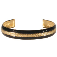 Bracelet jonc ouvert rigide en acier doré et pavé d'émail de couleur noir.