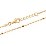 Bracelet en plaqué or et perles en émail.