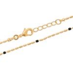 Bracelet en plaqué or 18 carats et perles en émail noir.