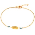 Bracelet avec feuille en plaqué or et deux perles de couleur turquoise.