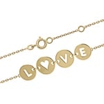 Bracelet avec 4 médailles rondes et les lettres ajourées du mot LOVE en plaqué or. Fermoir anneau ressort avec anneaux de rappel à 15.5 cm et 17.5 cm.