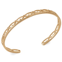 Bracelet jonc ouvert aux motifs ajourés en plaqué or jaune 18 carats.