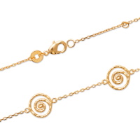 Bracelet composé d'une chaîne et de 4 spirales en plaqué or jaune 18 carats. Fermoir mousqueton avec anneaux de rappel à 16 et 18 cm.
