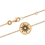 Bracelet avec pastille motif étoile en plaqué or et oxydes de zirconium de couleur noire.