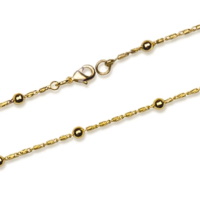 Collier composé d'une chaîne avec boules en plaqué or jaune 18 carats.