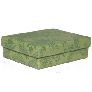 Ecrin pour parure de couleur verte avec motifs. Intérieur mousse.