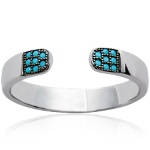 Bague en argent 925/000 rhodié et turquoise synthétique.