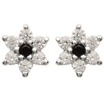 Boucles d'oreilles étoile en argent 925/000 rhodié serties d'une pierre d'imitation onyx et pavées d'oxydes de zirconium blancs.  