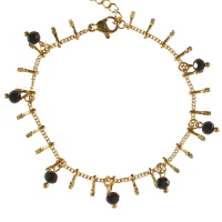 Bracelet composé d'une chaîne avec pampilles en acier doré et de perles de couleur noire. Fermoir mousqueton avec 2,5 cm de rallonge.