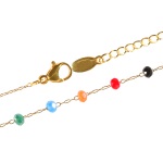 Bracelet en acier doré et perles multicolores.