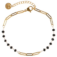 Bracelet composé d'une chaîne en acier doré avec perles de couleur noire. Fermoir mousqueton avec 3 cm de rallonge.