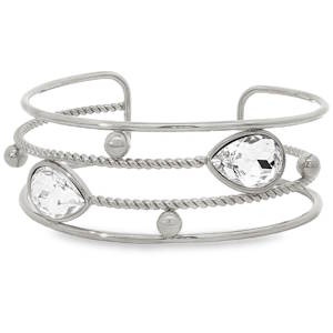 Sublime bracelet jonc en acier argenté, une pièce d'éclat. Orné de cristaux taillés en poire avec une coupe brillant, ce bracelet associe luxe et modernité. Sa clarté VVS, son poli excellent et sa symétrie impeccable accentuent son allure. Un accessoire parfait pour sublimer votre style avec élégance.
