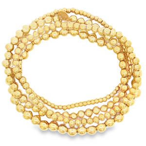 Ce somptueux lot de 4 bracelets élastiques en acier doré se compose de perles sphériques harmonieusement agencées pour un éclat continu. Le montage assure une symétrie parfaite et un tombé fluide sur le poignet. Un bijou intemporel idéal pour une élégance quotidienne ou une occasion spéciale.
