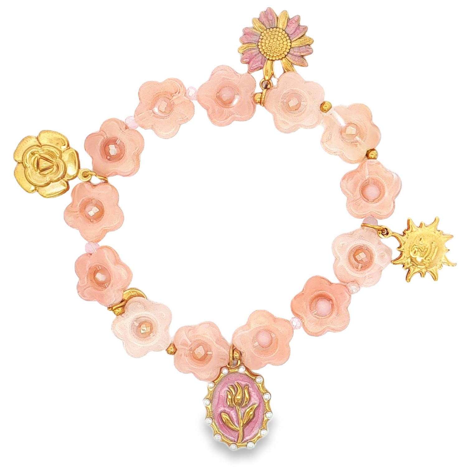 Ce bracelet élastique arbore un style printanier et poétique, mêlant des textures translucides à des éclats métalliques dorés.<br/>Le corps du bracelet est composé d'une succession de fleurs roses à la finition translucide. Chaque fleur est centrée d'un petit cristal rose scintillant, apportant une touche de lumière constante.<br/>Quatre éléments distinctifs viennent ponctuer le cercle, offrant un contraste élégant avec le rose dominant.<br/>Une marguerite délicate aux pétales roses et au cœur doré.<br/>Un soleil rayonnant stylisé en acier doré.<br/>Un médaillon ovale d'inspiration vintage représentant une tulipe dorée sur fond rose.<br/>Une rose épanouie en relief doré. Elastique Soleil Adolescent Adulte Eté Femme Fille Fleurs Nature Printemps Ce bracelet élastique arbore un style printanier et poétique, mêlant des textures translucides à des éclats métalliques dorés.<br/>Le corps du bracelet est composé d'une succession de fleurs roses à la finition translucide. Chaque fleur est centrée d'un petit cristal rose scintillant, apportant une touche de lumière constante.<br/>Quatre éléments distinctifs viennent ponctuer le cercle, offrant un contraste élégant avec le rose dominant.<br/>Une marguerite délicate aux pétales roses et au cœur doré.<br/>Un soleil rayonnant stylisé en acier doré.<br/>Un médaillon ovale d'inspiration vintage représentant une tulipe dorée sur fond rose.<br/>Une rose épanouie en relief doré. Elastique Soleil Adolescent Adulte Eté Femme Fille Fleurs Nature Printemps