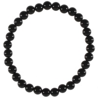 Bracelet boules élastique de perles en véritable pierre d'agate noire. L'agate représente l'équilibre et l'harmonie. Elle est symbole de force et de soutien dans les moments difficiles en recentrant les énergies. Pierre d'ancrage à la terre, elle aide à disperser les énergies négatives et confère stabilité et confiance de soi.