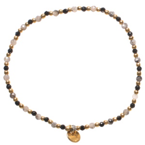 Bracelet élastique composé de perles en acier doré et perles de couleur noire et grise.