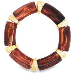 Ce bracelet bangle, fabriqué à partir de matériaux non métalliques avec des accents dorés jaunes, offre un style unique et accrocheur. Le design sans pierre précieuse met en valeur la beauté des matériaux utilisés, créant un accessoire de mode distinctif qui ajoute une touche d'élégance à toute tenue.