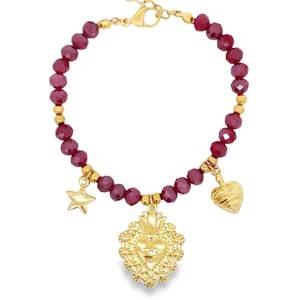 Ce bracelet charmant en acier doré présente un design éclatant. Les détails dorés, associés aux perles et ornements distinctifs, offrent une élégance intemporelle.  Idéal pour ajouter une touche de sophistication à votre style quotidien. Fermoir mousqueton avec 3 cm de rallonge.