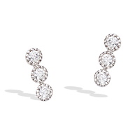 Boucles d'oreilles puces en argent 925/000 rhodié et 3 oxydes de zirconium blancs sertis clos.