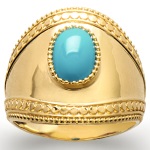 Bague large en plaqué or et pierre d'imitation turquoise.