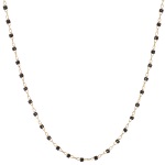 Collier en acier doré et perles de couleur noire.