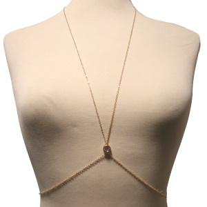 Collier de corps composé d'une chaîne en acier doré et d'un strass serti clos.<br/Fermoir mousqueton avec 15 cm de rallonge pour le collier et 15 cm de rallonge pour la taille.