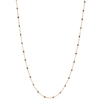 Collier sautoir composé d'une chaîne en acier doré et de perles en émail de couleur noire. Fermoir mousqueton avec 7 cm de rallonge.