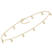 Bracelet chaîne cheville avec pampilles rondes en plaqué or jaune 18 carats.