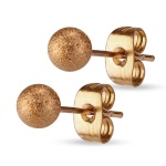 Boucles d'oreilles boules en acier rosé.