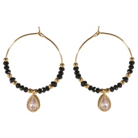 Boucles d'oreilles créoles avec perles en acier doré, perles de couleur noire et une goutte en acier doré sertie d'un cristal.