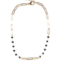 Bracelet chaîne de cheville composé d'une chaîne en acier doré et de perles de couleur noire. Fermoir mousqueton avec 3 cm de rallonge.