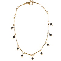 Bracelet chaîne de cheville en acier doré avec pampilles perles noires. Fermoir mousqueton avec 3 cm de rallonge.