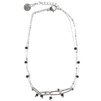 Bracelet chaîne de cheville double rangs composé d'une chaîne en acier argenté avec pampilles de perles de couleur noire, ainsi qu'une chaîne en acier doré avec perles de couleur noire. Fermoir mousqueton avec 3 cm de rallonge.