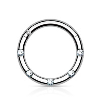 Piercing anneau en acier chirurgical 316L argenté serti de 5 cristaux.