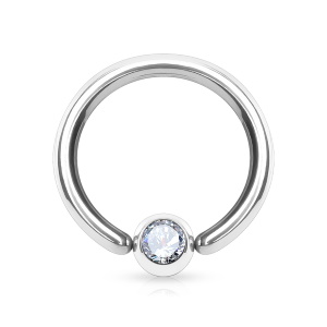 Piercing anneau en acier chirurgical 316L argenté avec un cristal serti clos.