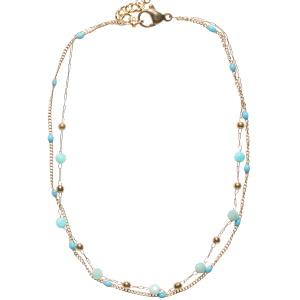 Bracelet chaîne de cheville double rangs composé d'une chaîne en acier doré et de perles en émail de couleur turquoise, ainsi qu'une chaîne avec des perles en acier doré et des perles turquoises. Fermoir mousqueton avec 5 cm de rallonge.