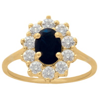 Bague marquise en plaqué or jaune 18 carats surmontée d'un oxyde de zirconium bleu saphir entouré d'un pavage d'oxydes de zirconium blancs.