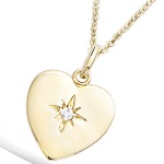 Pendentif cœur en plaqué or et étoile oxyde de zirconium.