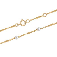 Bracelet composé d'une chaîne en plaqué or jaune 18 carats et de perles d'eau douce. Fermoir anneau ressort avec anneaux de rappel à 16 et 18 cm.