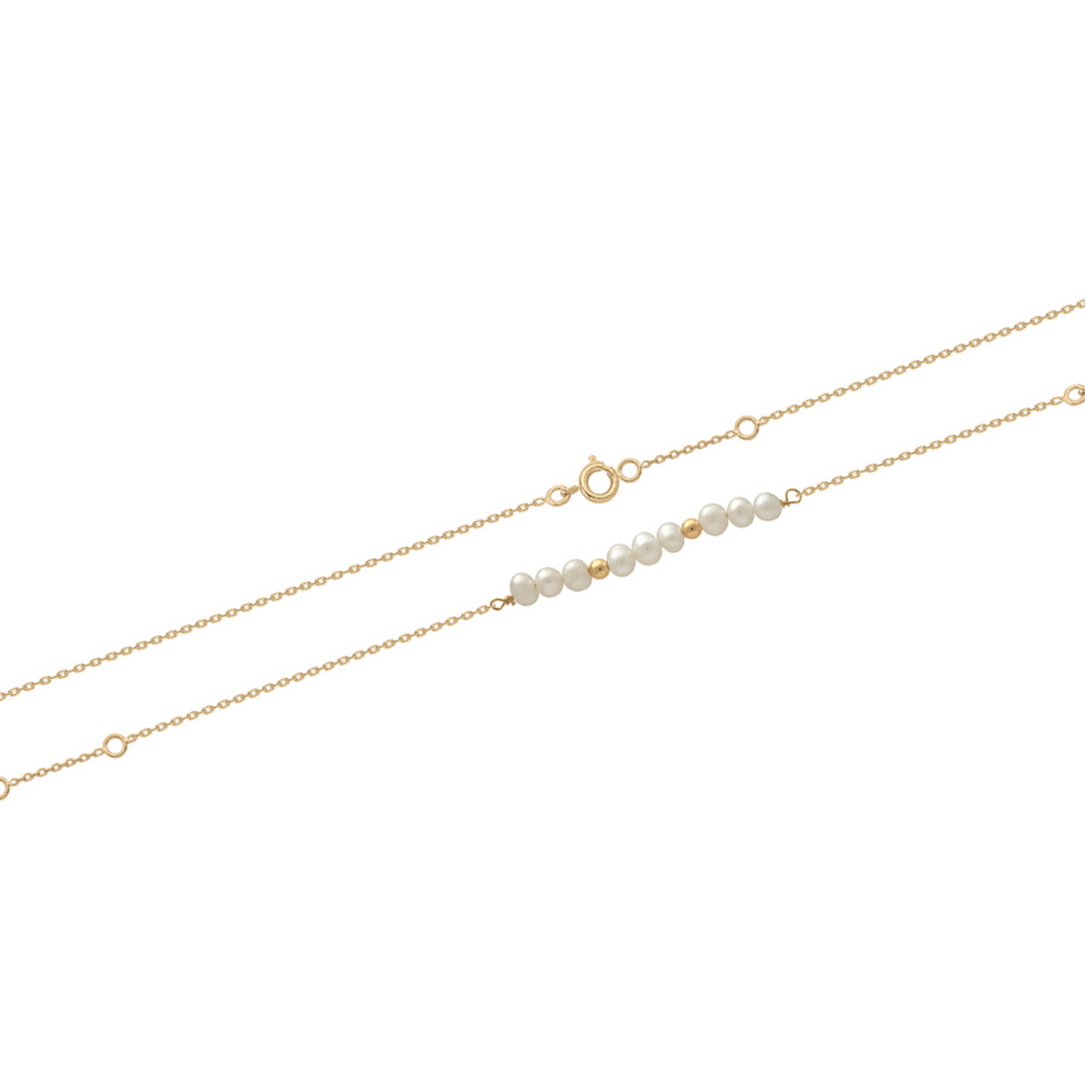 Bracelet composé d'une chaîne avec 2 perles en plaqué or jaune 18 carats et de perles d'eau douce.<br/>Fermoir anneau ressort avec anneaux de rappel à 15.5 et 17.5 cm. Boule Perle Rond  Adolescent Adulte Femme Fille Indémodable 