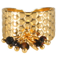 Bague large en acier doré avec pompon de perles de couleur noire. Taille ajustable.