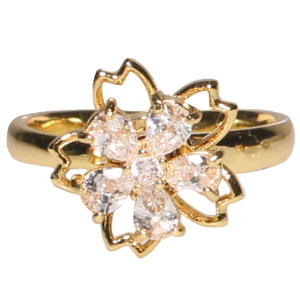 Bague en acier doré surmontée d'une fleur rotative sertie de strass. Bague anti stress avec un objet rotatif pour soulager l'anxiété et le stress. Taille ajustable.
