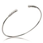 Bracelet jonc rigide ouvert en argent 925/000 rhodié serti d'oxydes de zirconium blancs.