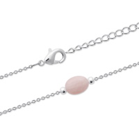 Bracelet composé d'une chaîne en argent 925/000 rhodié et d'une véritable pierre de quartz rose de forme ovale. Fermoir mousqueton avec anneaux de rappel à 16 et 18 cm.