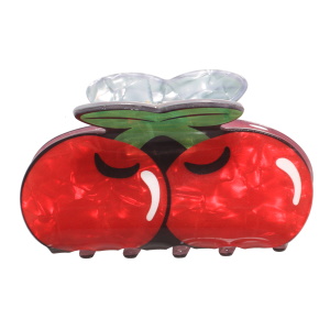 Pince crabe pour cheveux en forme de cerises.