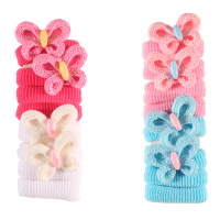 Lot de 8 élastiques cheveux pour enfants en textile de couleur surmontés de papillon. 2 modèles différents. Votre choix en commentaires. Vendu par lot.