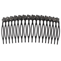 Peigne cheveux en métal noir et strass.