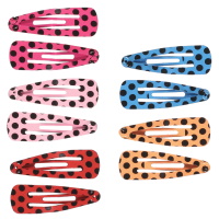 Lot de 10 clic-clacs avec motifs en métal peint.